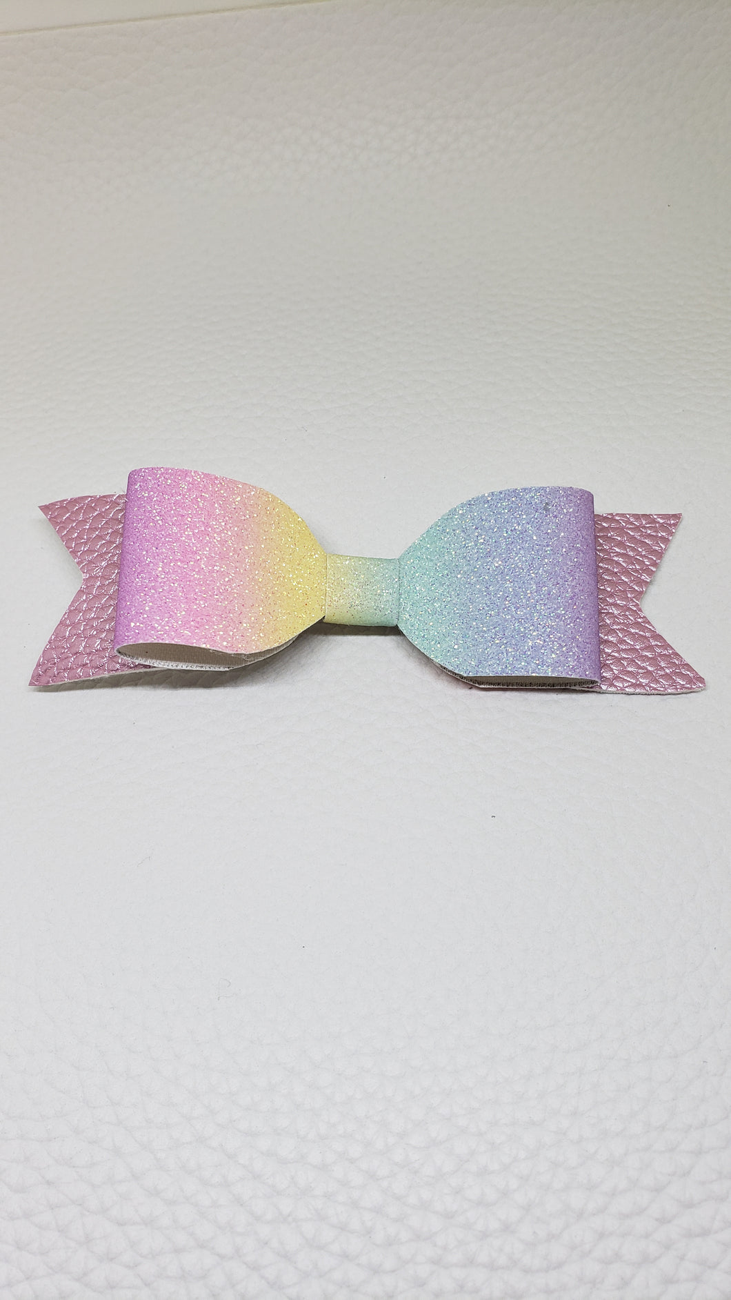 Rainbow hair clip with pastel pink.